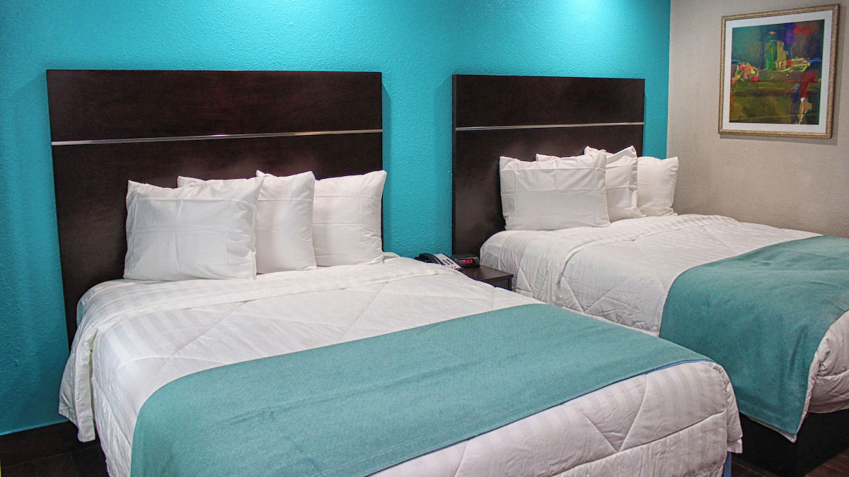 Spanish Trails Inn guest room with two beds